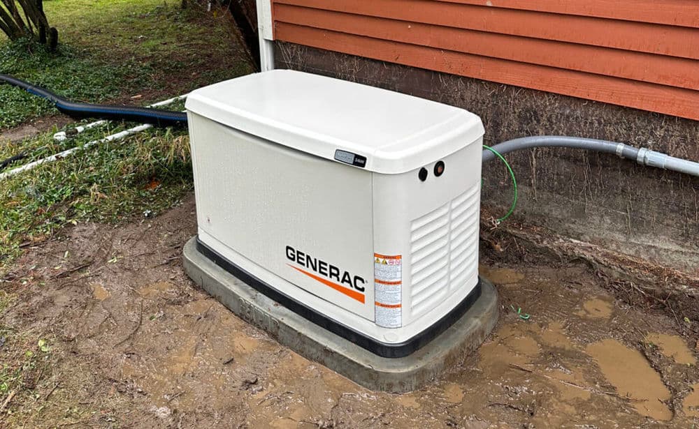 Generac home standby generator installed outside a house for emergency power backup.